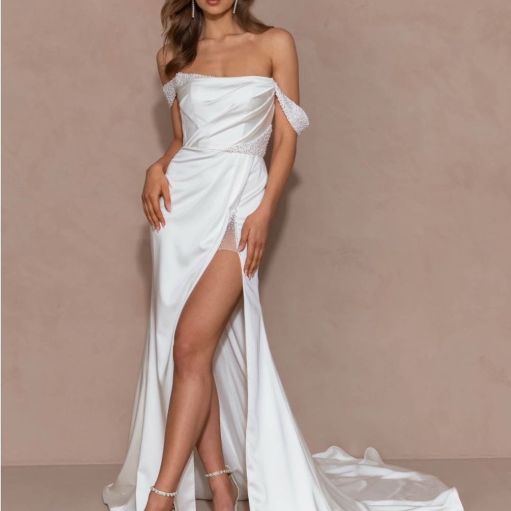 Elegant Off-Shoulder Pearl-Embellished Wedding Dress. High slit.